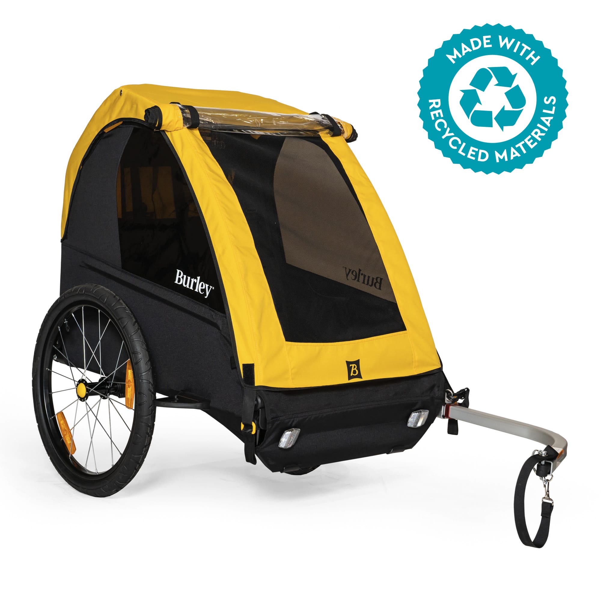 Yellow Burley Bee child bike trailer hitched behind a bicycle. Image via Burley.