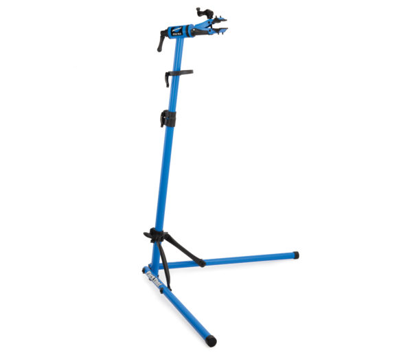 Park Tool PCS-10.3 blue folding repair stand with cam-actuated clamp. Image via Park Tool.