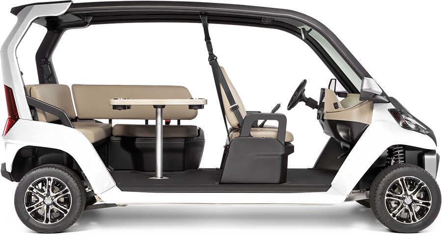 White Club Car CRU six-passenger LSV with rear lounge seating, side profile. Image via Club Car.
